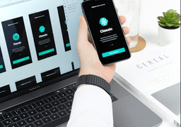 Person holding smartphone with app designs