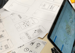 Sketches and laptop with map