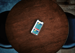 Smartphone on table with colorful app